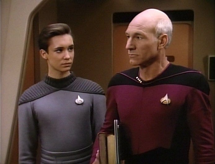 Scene from Star Trek TNG featuring characters in a tense situation