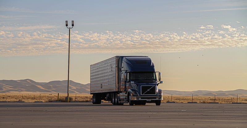 Electric truck charging at a station