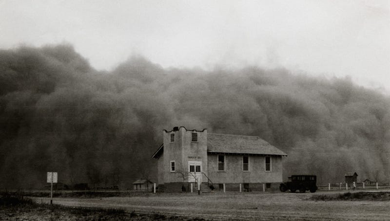 Dust storms ravaging farmland during the Dust Bowl era